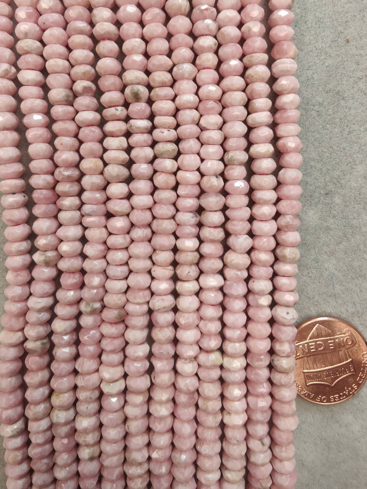 rhodochrosite faceted rondelle AA grade 3mmx5mm 16"strand