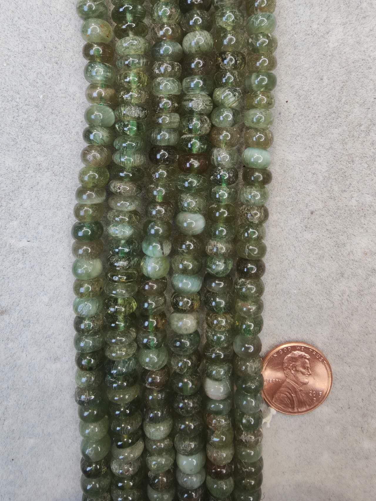 green garnet 5mmx8mm rondelle AAA grade 16"strand