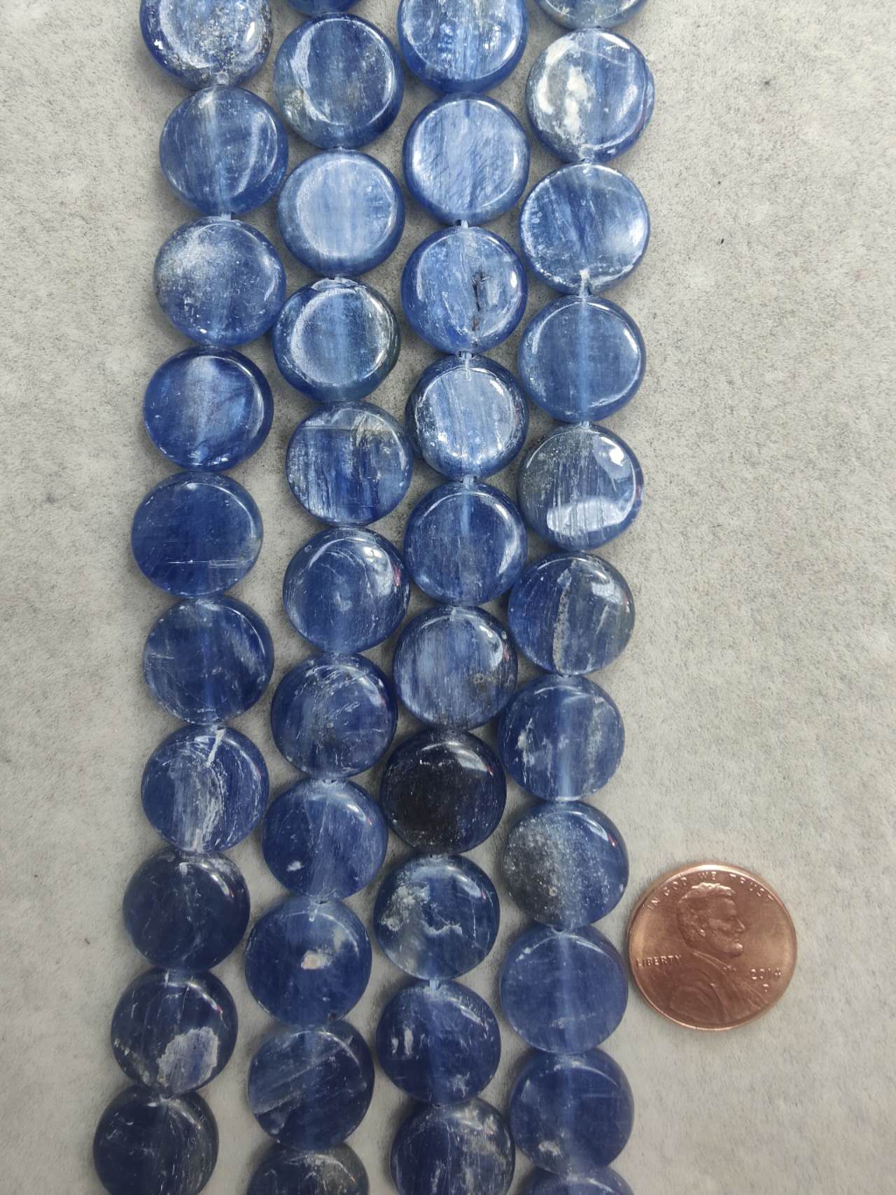 kyanite coin AA grade 14mm 16"strand