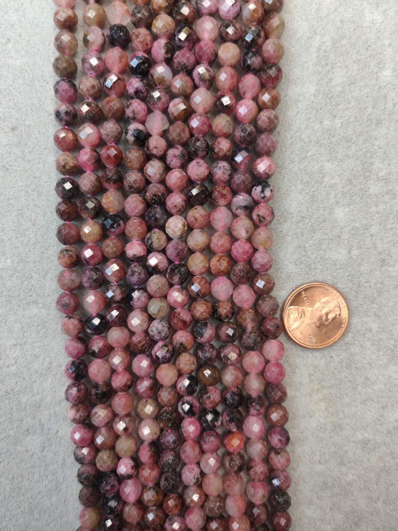 rhodonite 6mm faceted AAA grade 16"strand