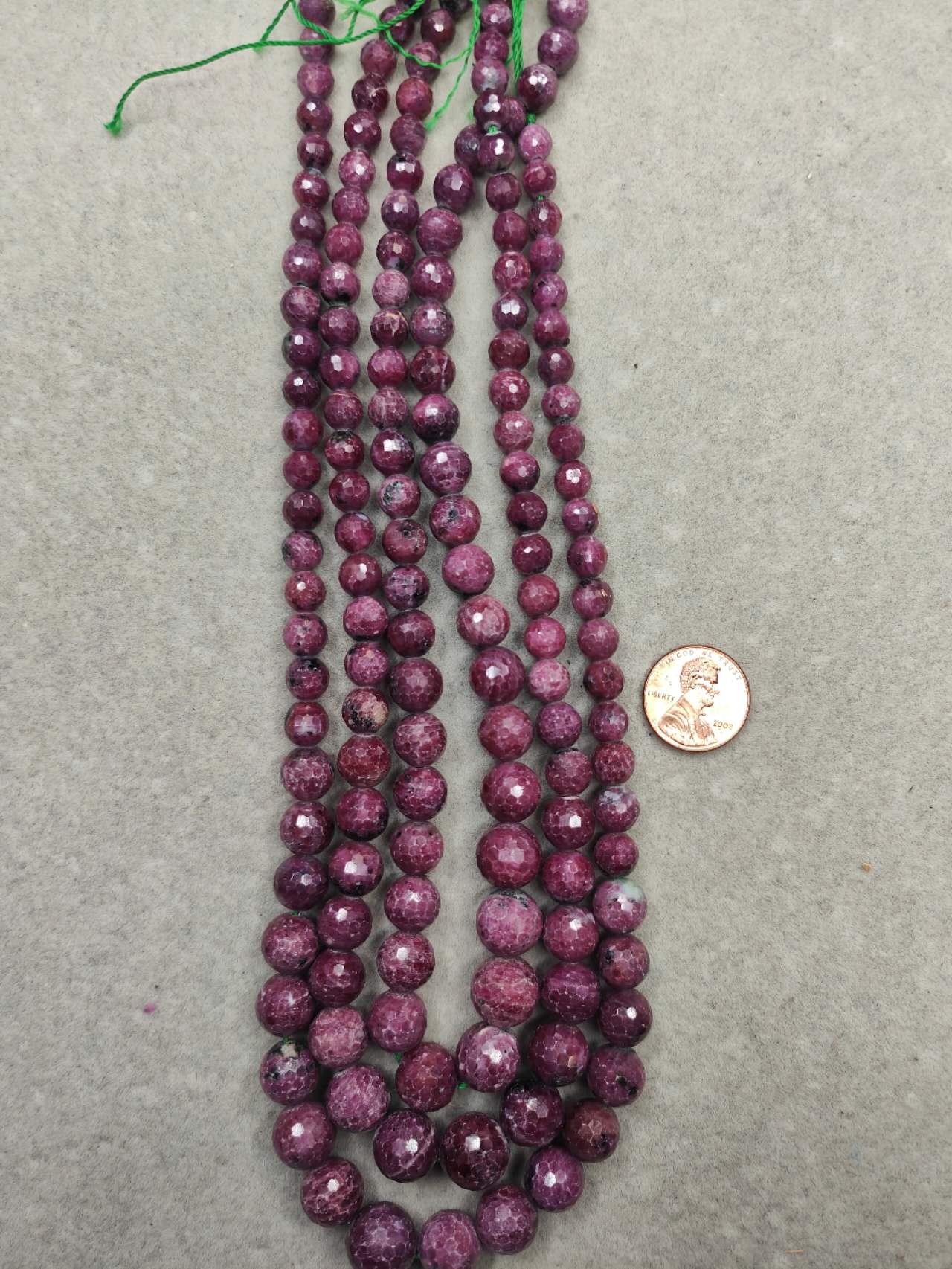 ruby round faceted from 7mm to 12mm graduate 16"strand