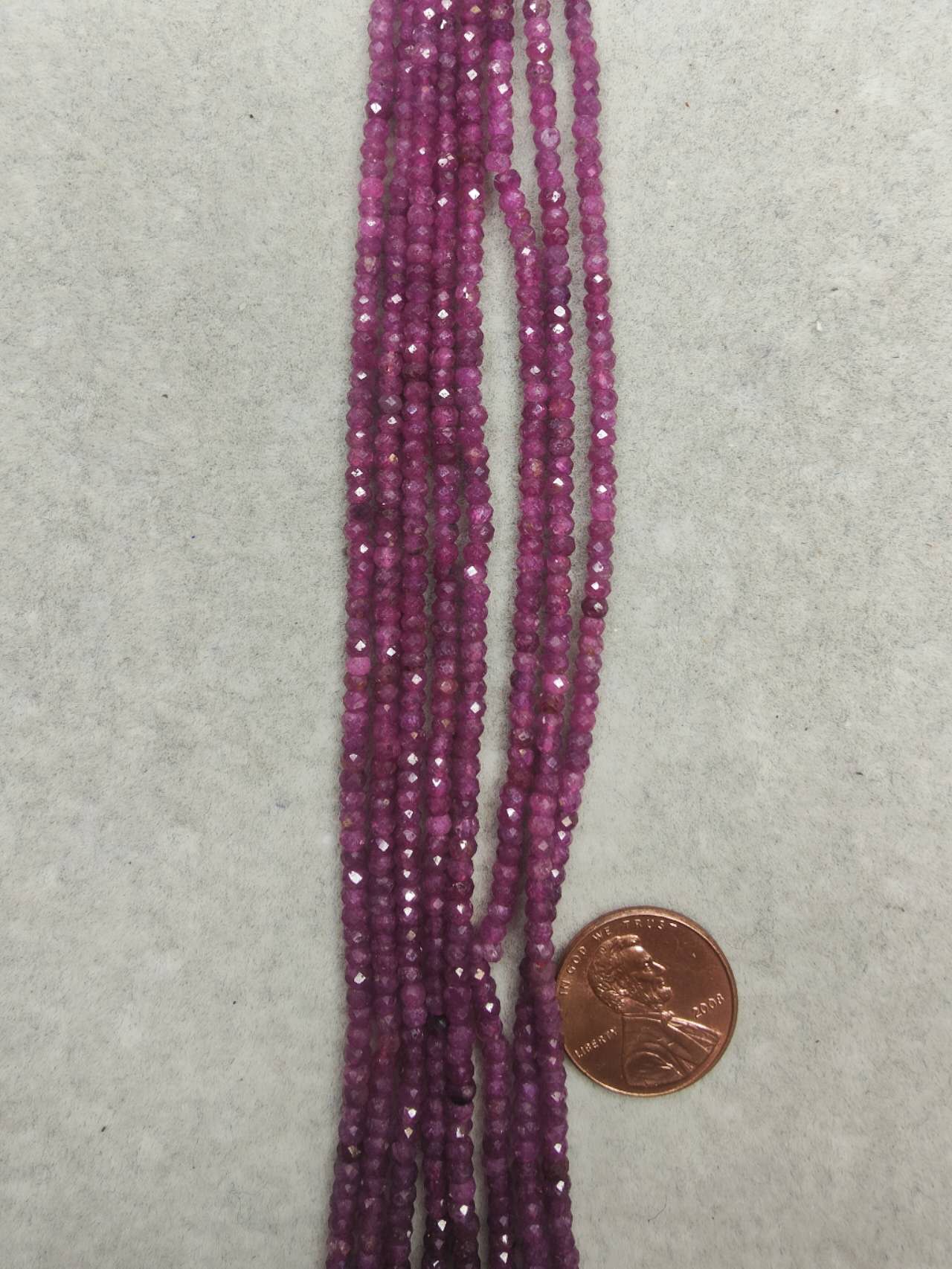 ruby 2mmx3mm rondelle faceted 16"strand