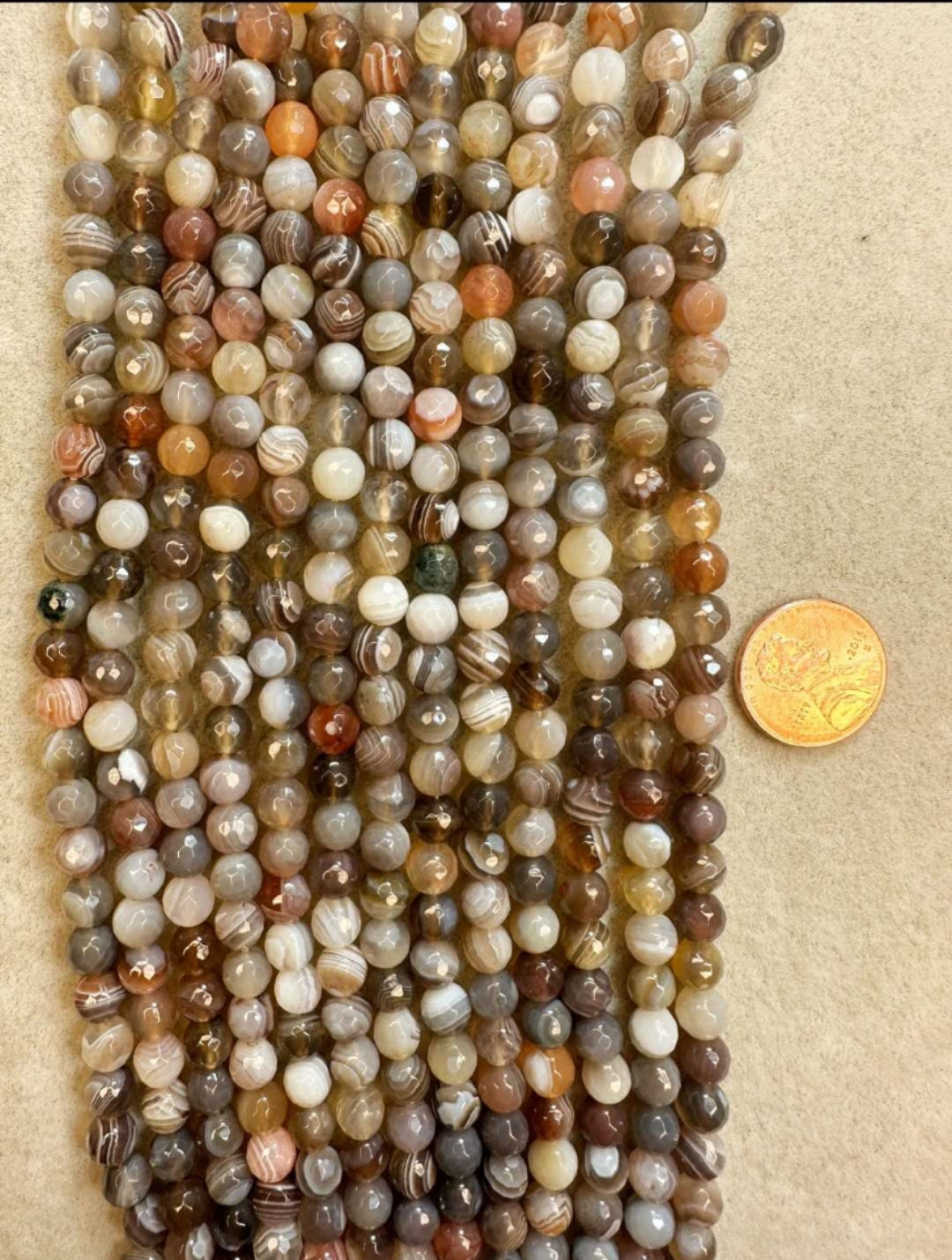 botswana agate round faceted 6.5mm 15.5" strand
