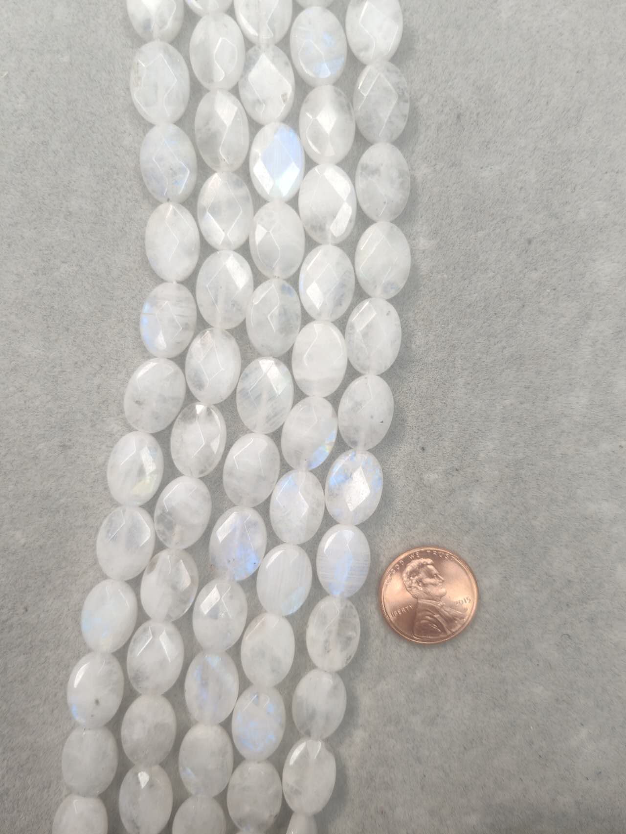 moonstone oval shape faceted AAA grade 10mmx14mm 16"strand
