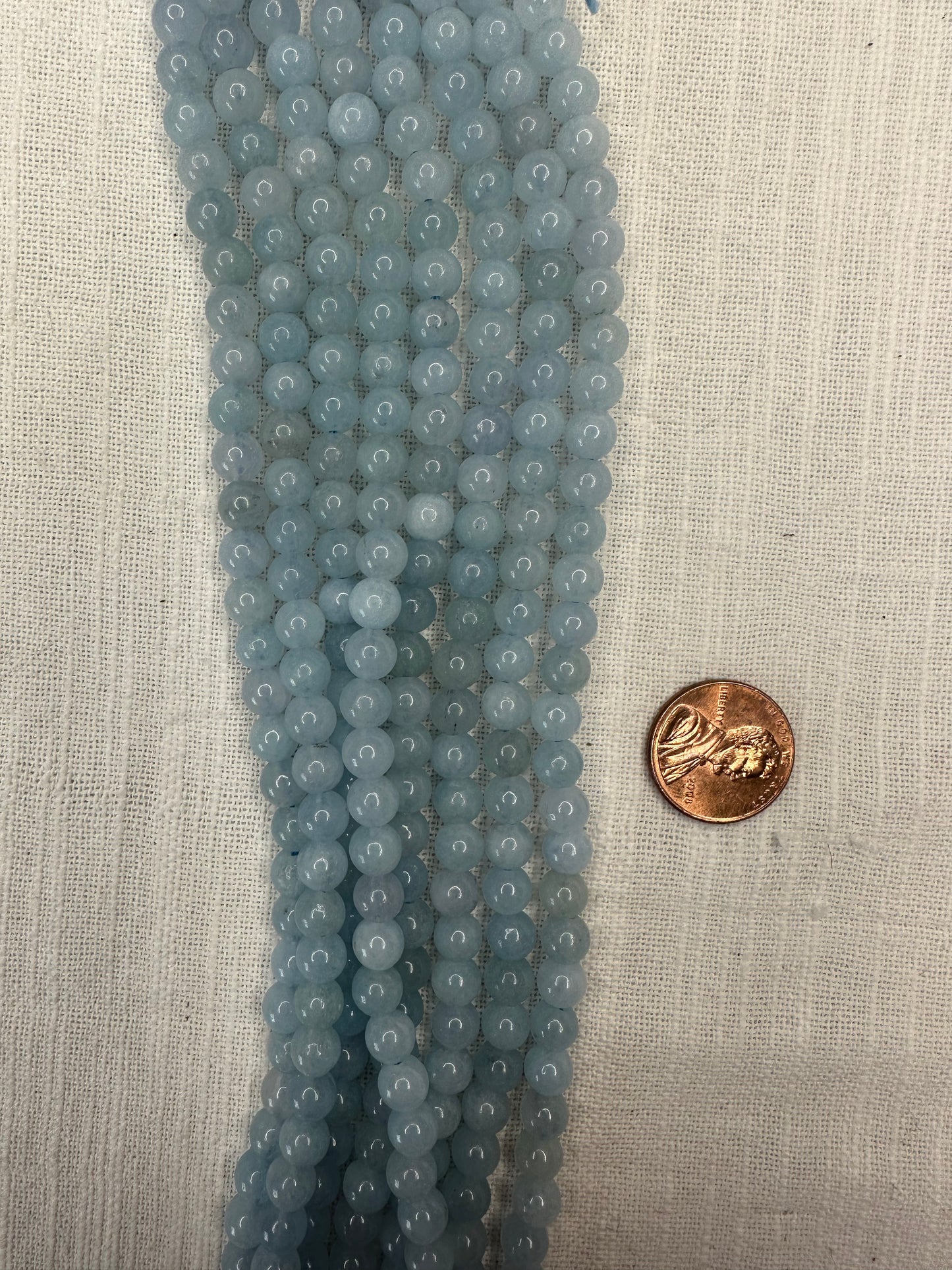 aquamarine 6mm round beads AAA grade  16"strand