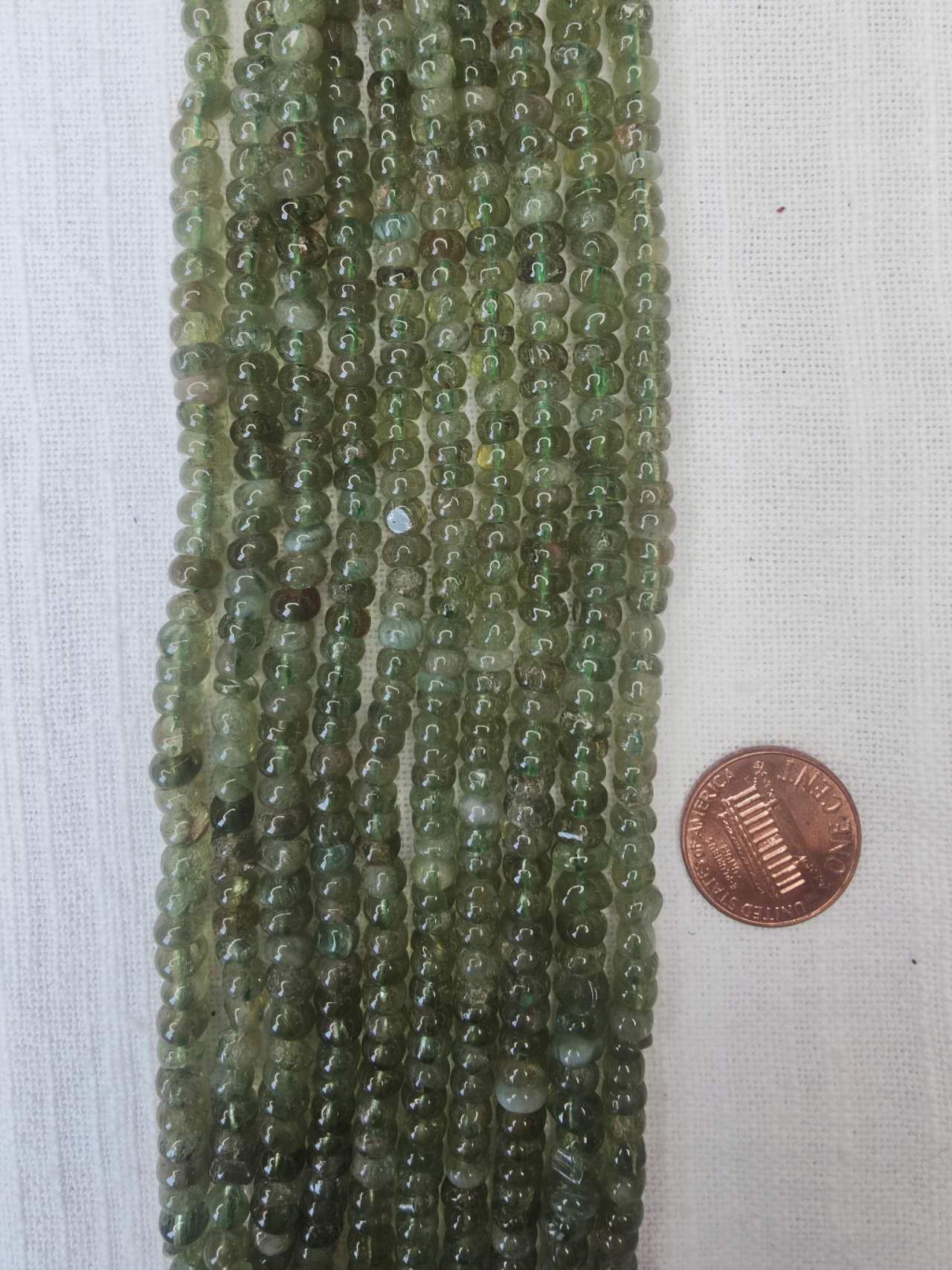 green garnet 3mmx5mm rondelle 15.5"strand