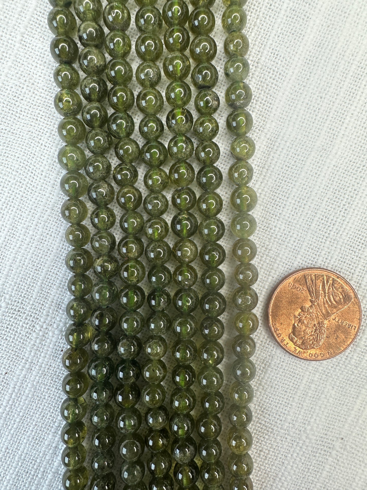 grossular green garnet 5.5mm round AAA grade 15.5"strand