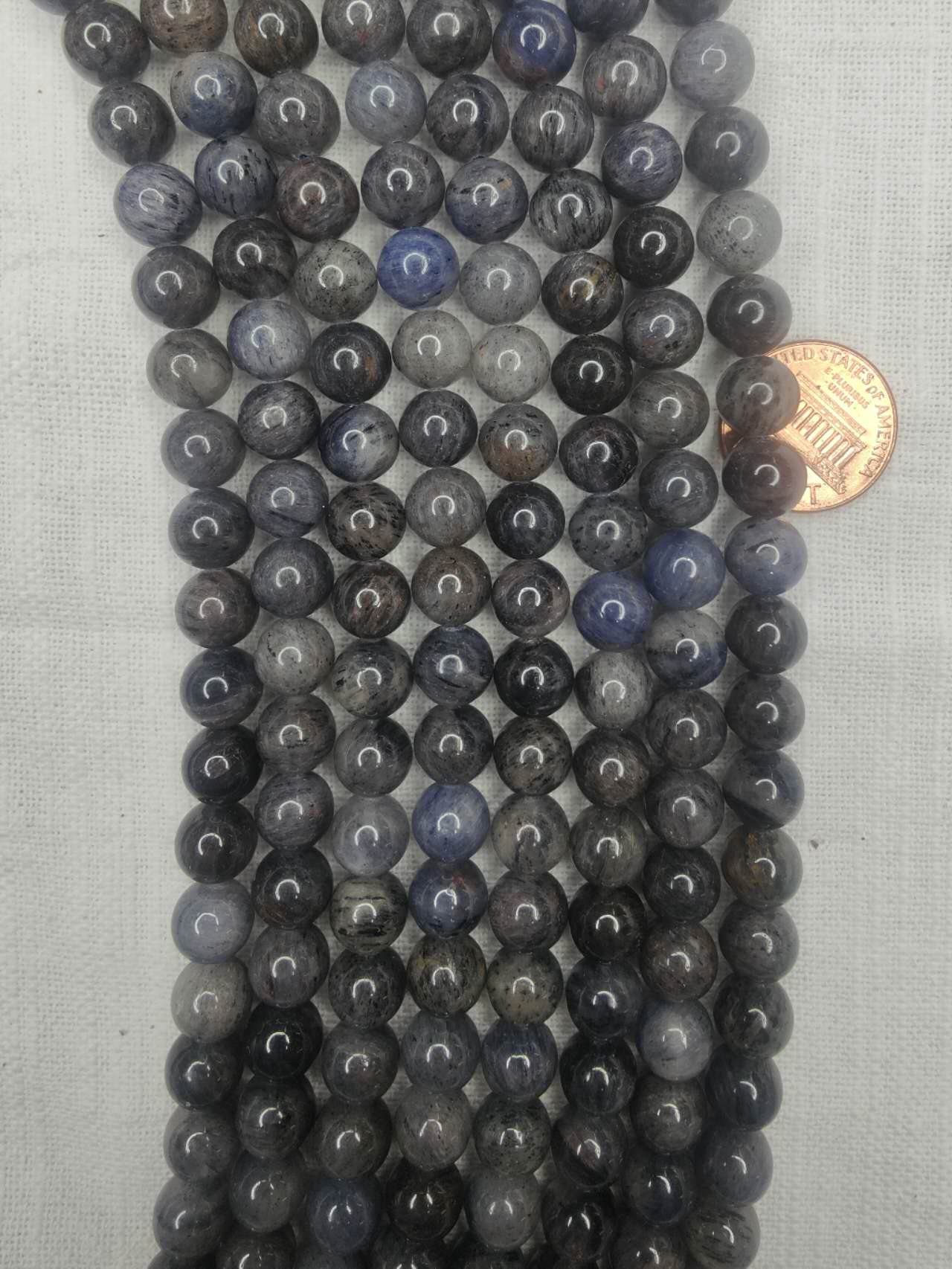 Iolite  9mm round AB grade beads 15.5"strand