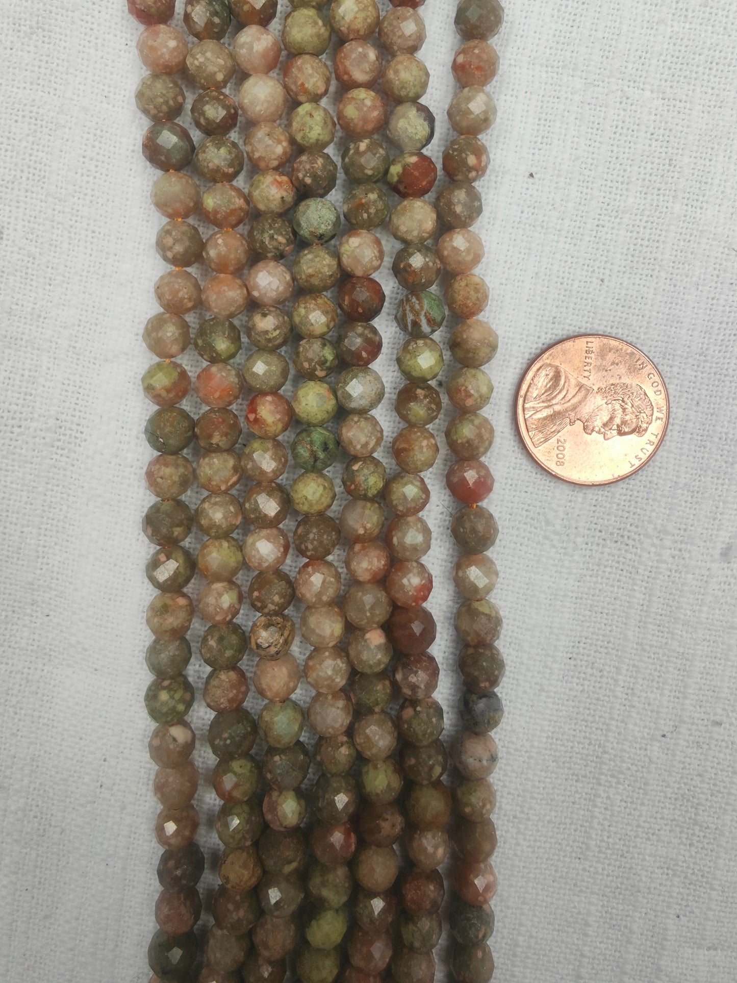 Kashgar Garnet 6mm round beads faceted AAA grade light color 15.5"strand