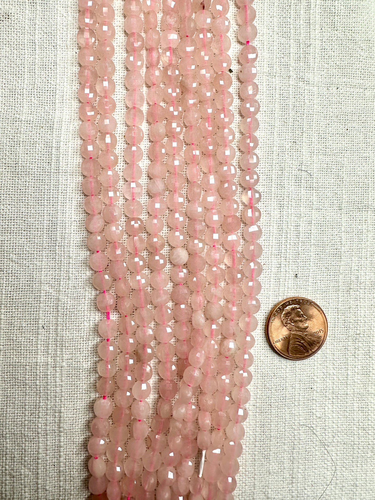 rose quartz faceted coin shape 5mm 16"strand