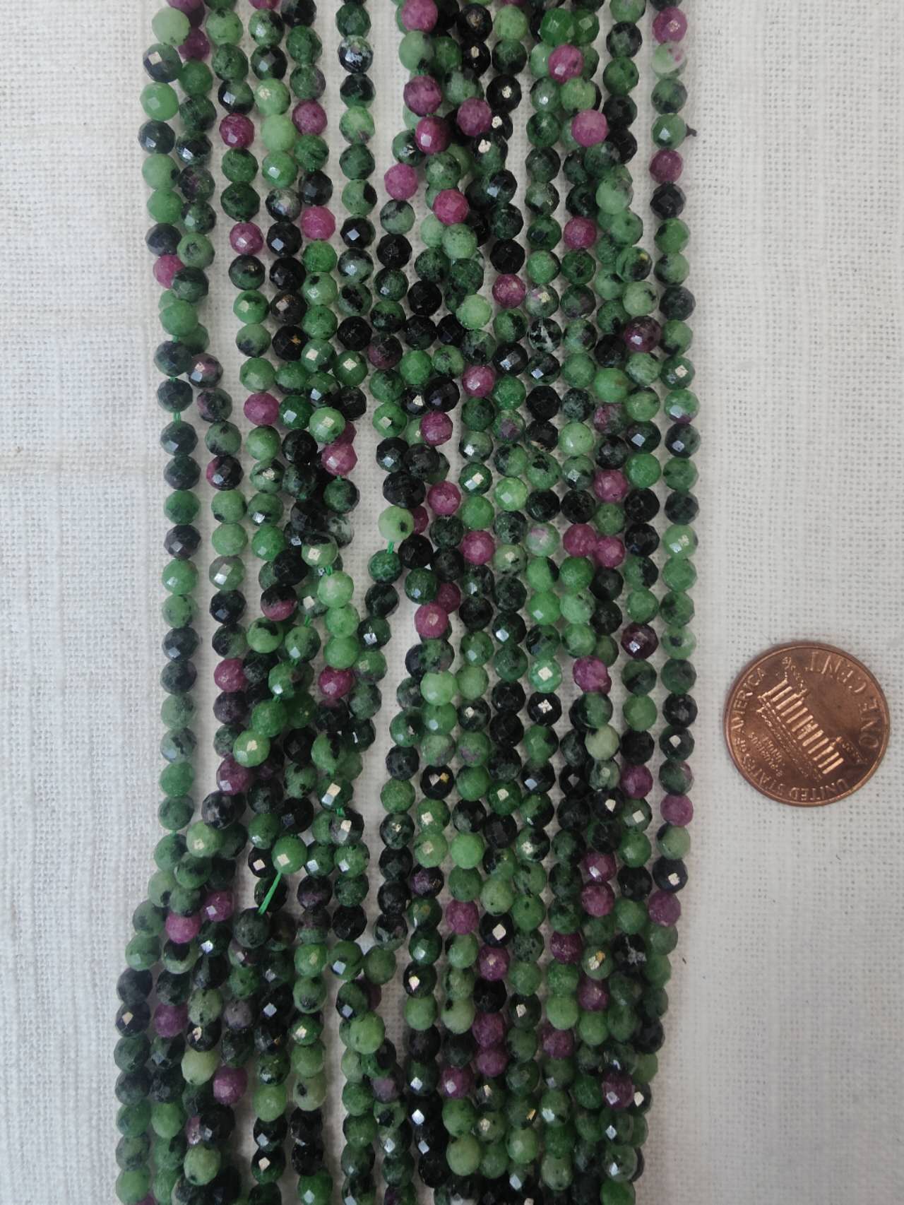 ruby in zoisite 4mm faceted round 15.5"strand