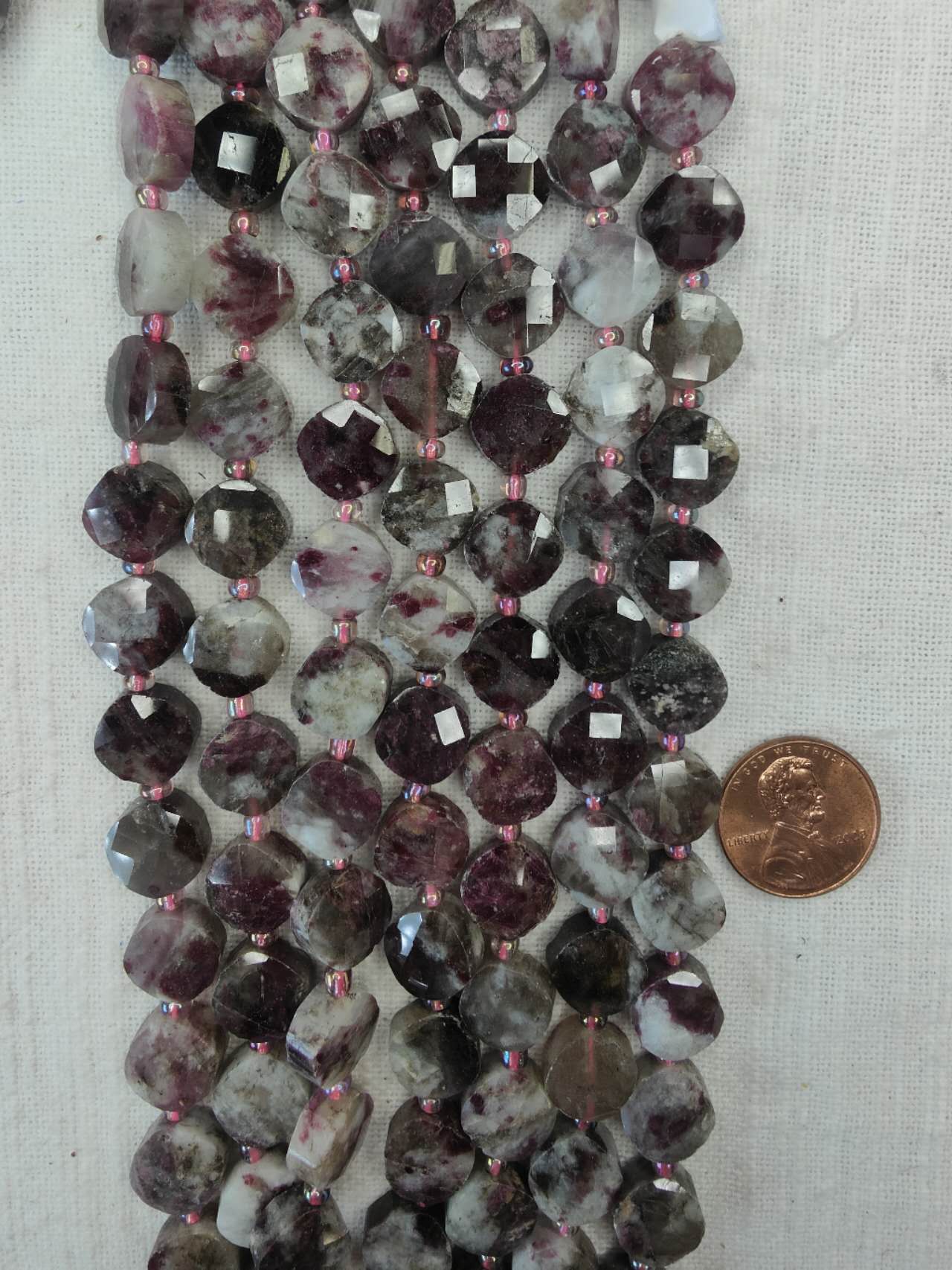 plum blossom tourmaline 11mm coin shape faceted 15.5"strand