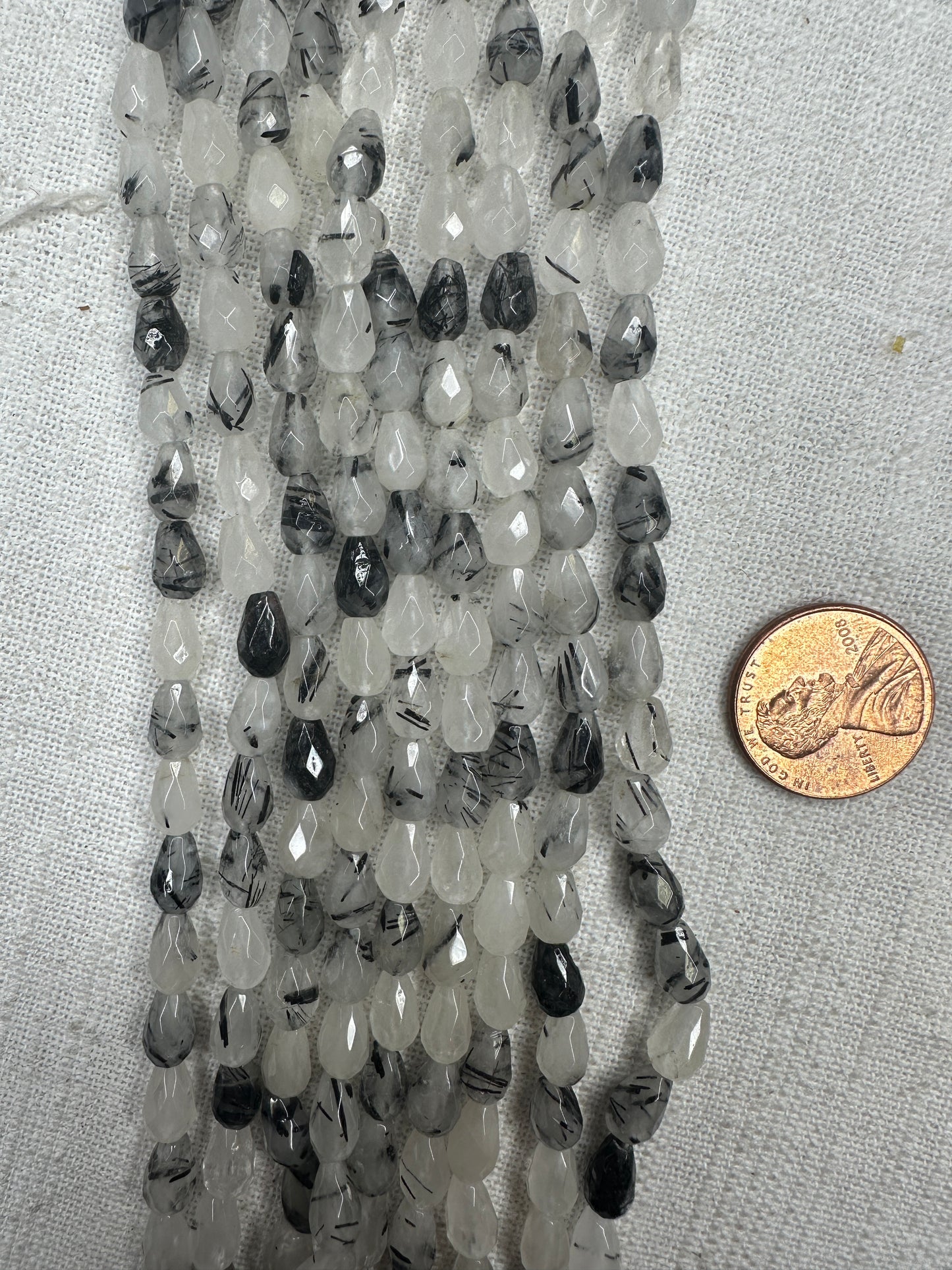 black tourmaline rutilated quartz 5mmx8mm teardrop shape faceted 15.5"strand